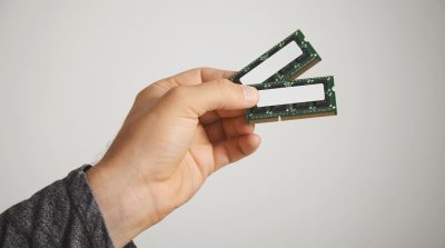 two-ram-chips-man-s-hand-isolated-white